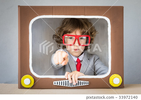 Child playing with cartoon TV Child playing with cartoon TV 33972140