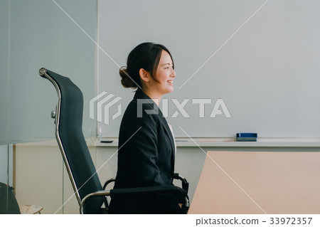 Young woman working in the office 33972357
