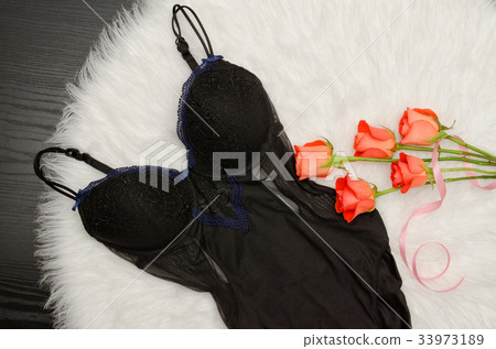 Black lace body on white fur and bouquet of roses Black lace body on white fur and bouquet of roses 33973189
