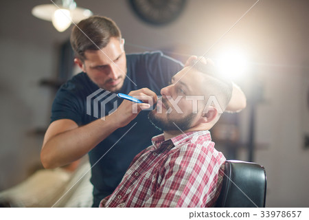 Young man at the barbershop Young man at the barbershop 33978657