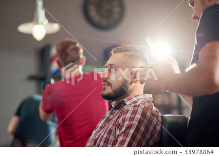 Young man at the barbershop 33978864