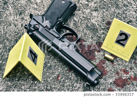 Crime scene investigation, Pistol and bullet shell 33998357