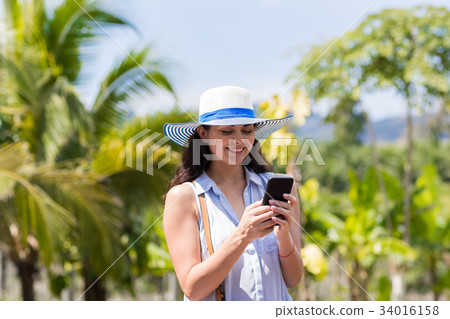 Young Woman Messaging With Cell Smart Phone Over 34016158