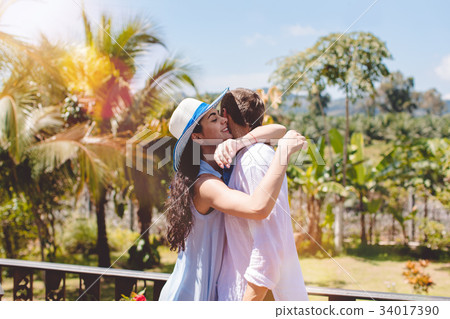 Happy Man And Woman Hugging On Terrace Or Balcony Happy Man And Woman Hugging On Terrace Or Balcony 34017390