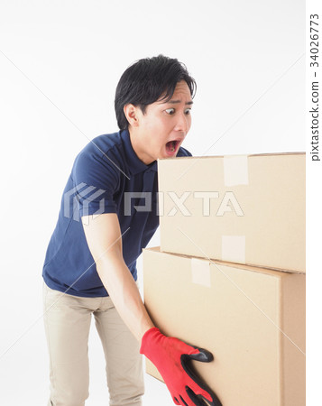 Worker holding a cardboard box to break the balance 34026773