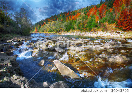 Mountain fast flowing river stream of water Mountain fast flowing river stream of water 34043705