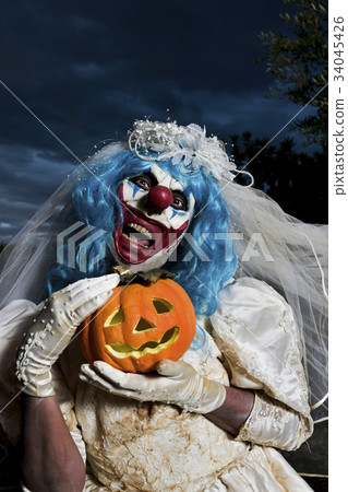 scary evil clown in a bride dress 34045426