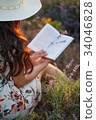 Romantic reading woman with book on lavender field 34046828