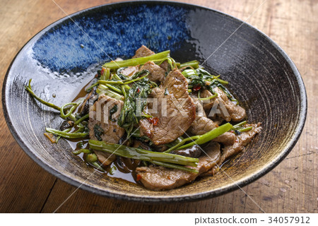 Stir Fried Thai Pad Nua with Morning Glory Stir Fried Thai Pad Nua with Morning Glory 34057912