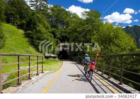 Father and daughter going in bicycle 34062417