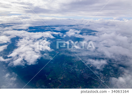 Beautiful  sky cloud  seeing through the airplane 34063164