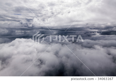 Beautiful sky cloud seeing through the airplane Beautiful sky cloud seeing through the airplane 34063167