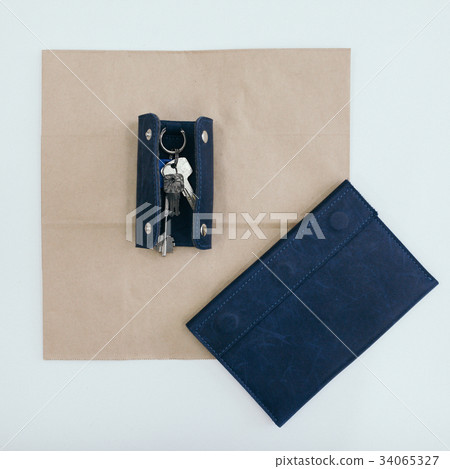Blue purse with keys. paper and white background Blue purse with keys. paper and white background 34065327