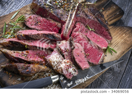 Barbecue Wagyu T-Bone Steak on old Cutting Board Barbecue Wagyu T-Bone Steak on old Cutting Board 34069056