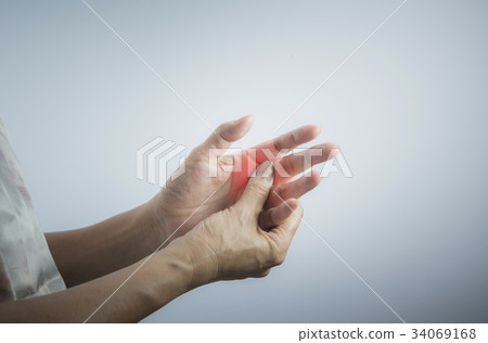 Woman massaging her painful hand. 34069168