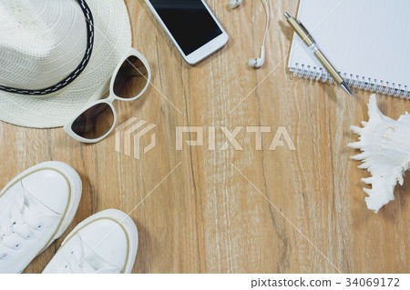 Top view of travel stuff. Essential travel items. 34069172