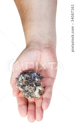 top view of zinc and lead mineral ore on male palm 34087161