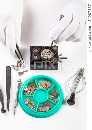 top view of repairing old mechanical watch 34087577