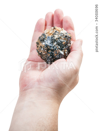 above view of zinc and lead ore on male palm 34088696