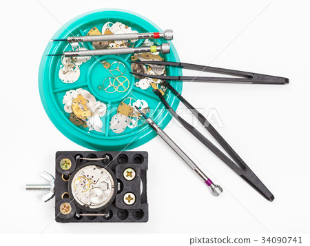 top view of tools and parts for repairing watch top view of tools and parts for repairing watch 34090741