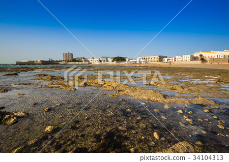 Old bathhouse on the beach of 'La Caleta' 34104313