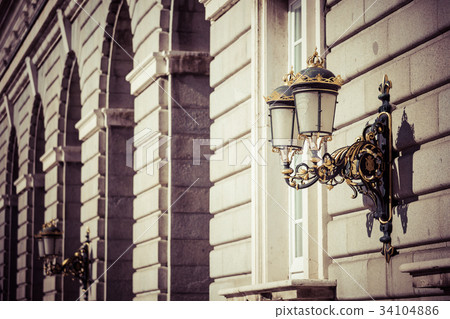 Elegant city lantern near royal palace in Madrid Elegant city lantern near royal palace in Madrid 34104886