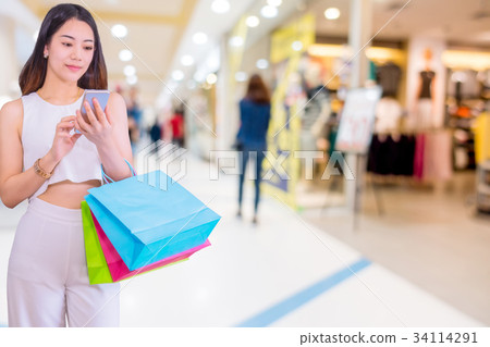 Woman with shopping bags. 34114291