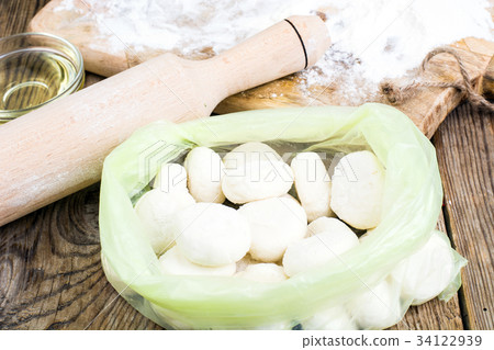 Small flour cookies on wooden board 34122939