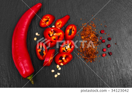 Spice in cooking red chili pepper on black stone 34123042