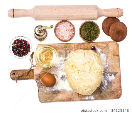 Ball of pizza dough on wooden kitchen cutting 34125348