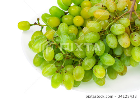 Branch of green grapes on white background 34125438