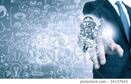 Businessman activating gears mechanism Businessman activating gears mechanism 34137643