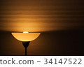 Lampshade on wallpaper 34147522