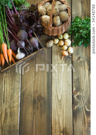 Fresh vegetables on old wooden board. Harvest. Fresh vegetables on old wooden board. Harvest. 34148788