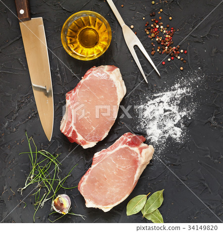 Raw pork steaks with spices 34149820