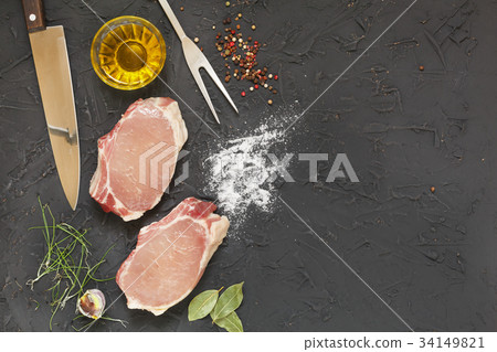 Raw pork steaks with spices 34149821