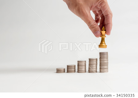 Asian man hand finger gesture on coins. Asian man hand finger gesture on coins. 34150335