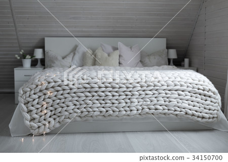 White nordic bedroom interior with knit plaid White nordic bedroom interior with knit plaid 34150700