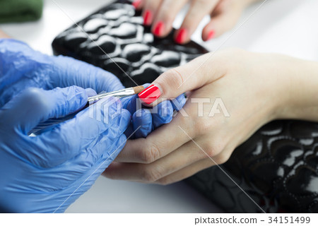 Manicure series: applying clear nail polish 34151499