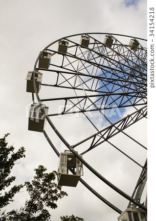 Ferris wheel against the blue sky Ferris wheel against the blue sky 34154218