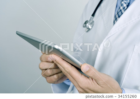 doctor man using a tablet computer 34155260