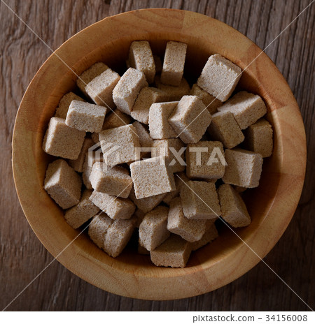 Brown sugar cubes in bowl. Top view Brown sugar cubes in bowl. Top view 34156008