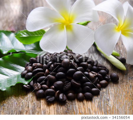 Coffee bean and flower on table background 34156054