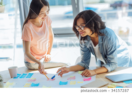 Joyful happy women studying together Joyful happy women studying together 34157287