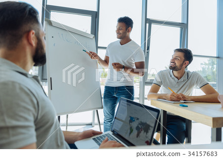 Joyful pleasant men listening to their training Joyful pleasant men listening to their training 34157683