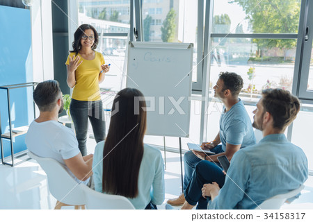 Positive good looking woman sharing her experience Positive good looking woman sharing her experience 34158317