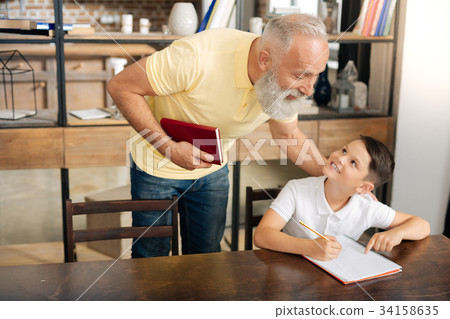 Little schoolboy asking grandfathers advice on Little schoolboy asking grandfathers advice on 34158635