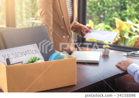 Close up of the hand employer filing final remuneration to resig 34158896