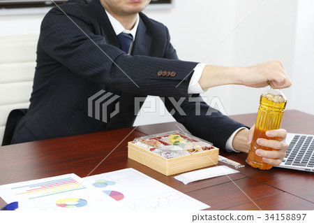 Businessman eating lunch Businessman eating lunch 34158897