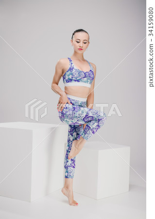 beautiful girl standing on one leg 34159080